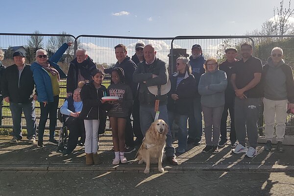 Steve Darling MP with a crowd of residents outside the blocked off entrance to the land at Darwin Crescent 