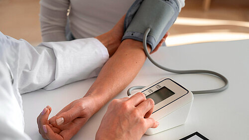 A picture of someone have their blood pressure checked 