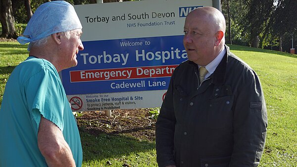 Steve Darling MP talking to a member of staff at Torbay Hospital 